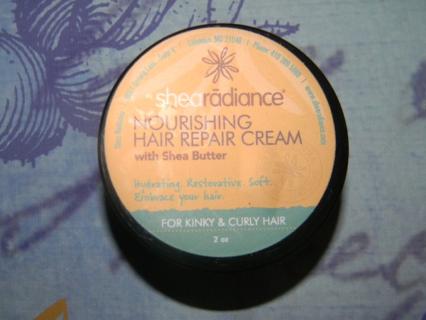 Contents inside of July 2012 curlbox beauty subscription program: shea radiance nourishing hair repair cream